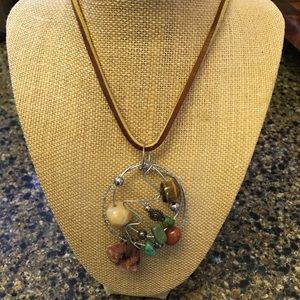 Hand-beaded leather necklace. 25” long